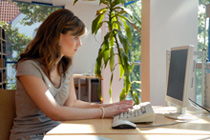 Photo of woman using computer