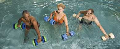 3 adults exercising in swimming pool