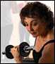 Woman exercising with dumbells