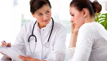 Woman talking with doctor