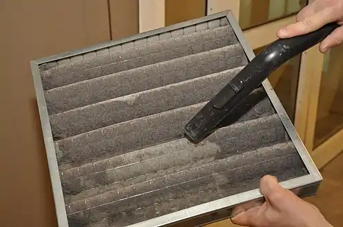 An air filter being cleaned