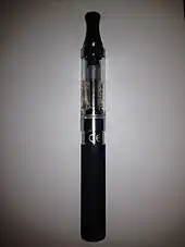 eGo style e-cigarette with a top-coil clearomizer. Silica fibers are hanging down freely inside of the tank, drawing e-liquid by capillary action to the coil that is located directly under the mouthpiece.