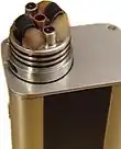 A view of the RDA deck showing the wicks and coils, e-liquid is dripped into a hopper where the wicks rest as well as atop the coil assembly.