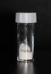 White powder in a stoppered glass vial