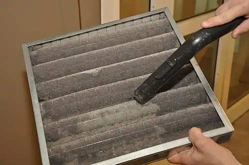 An air filter being cleaned