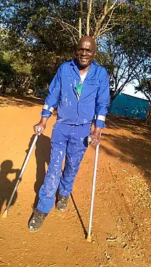 Man using forearm crutches