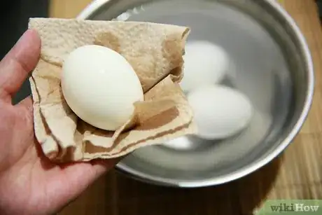 Image titled Peel a Hard Boiled Egg with the Crack and Roll Method Step 4