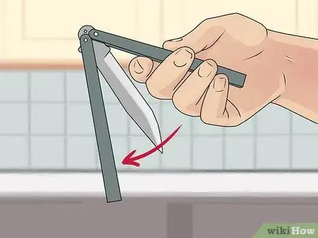 Image titled Perform a Trebuchet with a Butterfly Knife Step 10