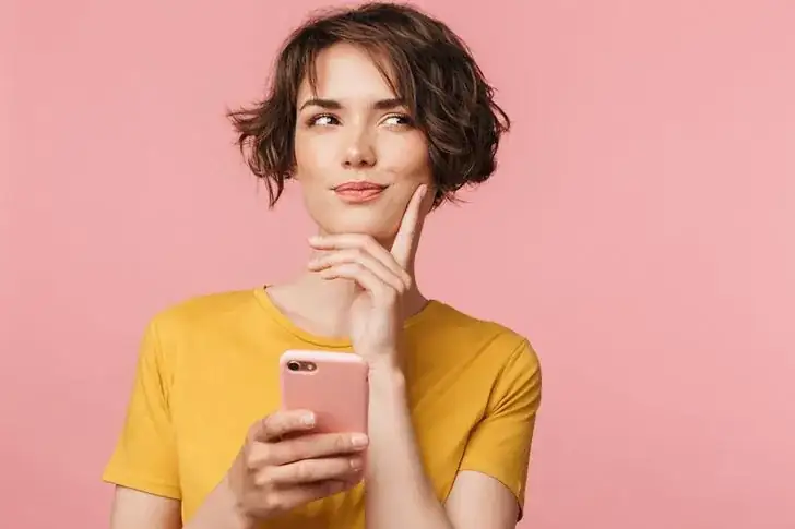 Canva girl hand chin smartphone.jpg