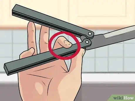 Image titled Perform a Trebuchet with a Butterfly Knife Step 6