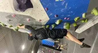 Perform a Dyno at a Rock Climbing Gym