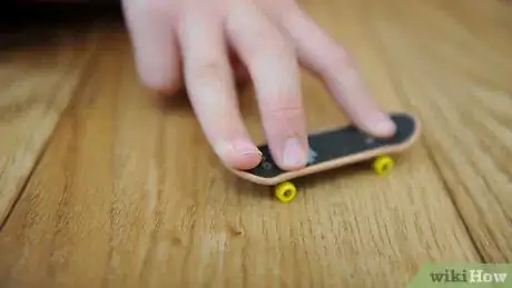 Image titled Ollie on a Tech Deck Using Three Fingers Step 3