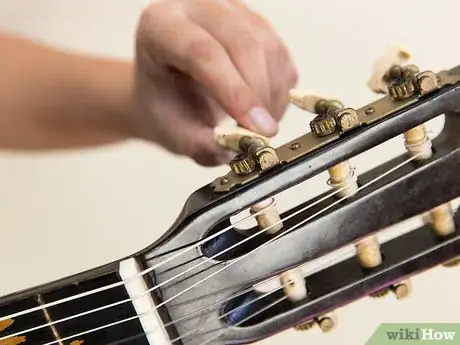 Image titled Change Strings on an Acoustic Guitar Step 17