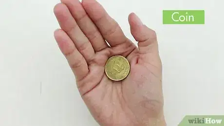 Image titled Palm a Coin Step 1