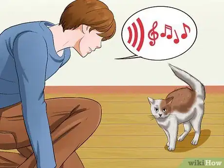 Image titled Pick Up an Aggressive Cat Step 1