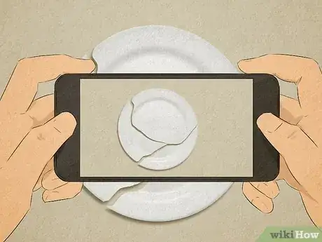 Image titled Person taking a photo of a broken plate on their phone to have as evidence.