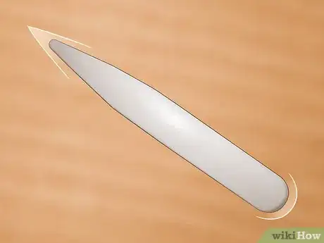 Image titled Use a Bone Folder Step 10