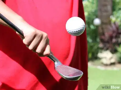 Image titled Juggle a Golf Ball on a Golf Club Step 3