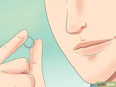 Image titled Take Your Nose Stud in and out of Your Nose Step 12