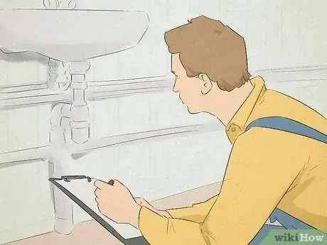 Image titled Man holding a clipboard examining a sink, taking notes on what needs repairs.