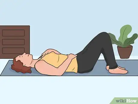 Image titled Stretch Your Lower Back While Lying Down Step 04