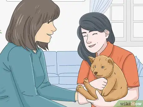 Image titled Get a Puppy to Stop Growling when You Pick Them Up Step 8