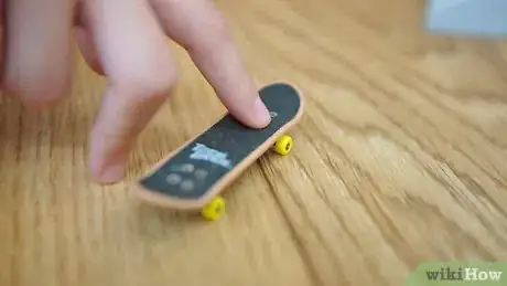 Image titled Ollie on a Tech Deck Using Three Fingers Step 1