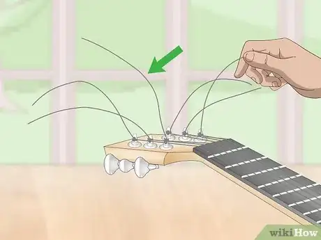 Image titled Fix Guitar Strings Step 1