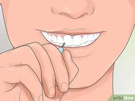 Image titled Pick Your Teeth Without a Toothpick Step 3