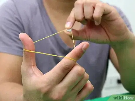 Image titled Make and Shoot Mini Paper Bullets with Rubber Bands Step 5