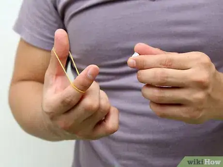 Image titled Make and Shoot Mini Paper Bullets with Rubber Bands Step 7