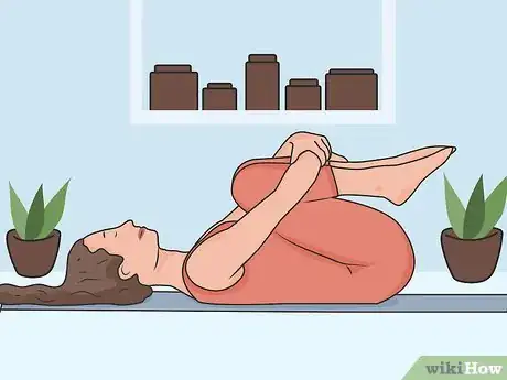 Image titled Stretch Your Lower Back While Lying Down Step 02