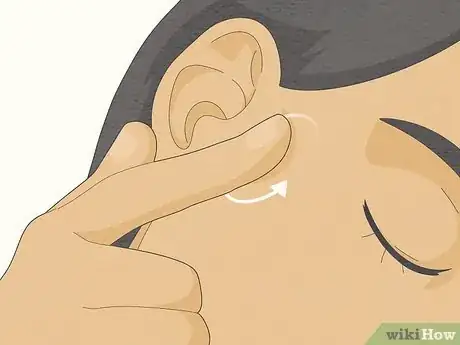 Image titled Massage Ear Wax Out Step 1