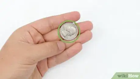 Image titled Roll a Coin on Your Knuckles Step 1