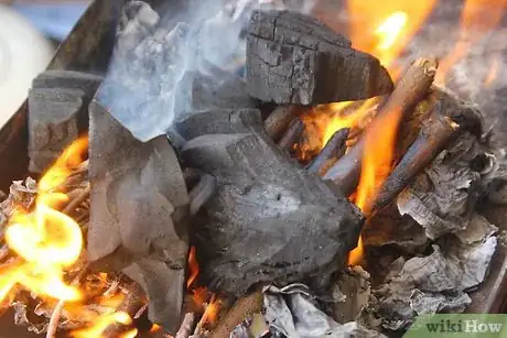 Image titled Create a Strong Burning Charcoal Fire Without Lighter Fluid Step 12