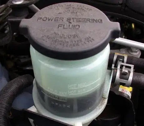 Image titled This power steering fluid reservoir has lines for the fluid level depending on whether the engine is hot or cold.