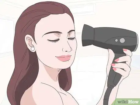 Image titled Get the Wet Hair Look Step 1