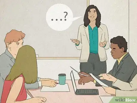 Image titled Woman presenting in front of her team and asking them questions.