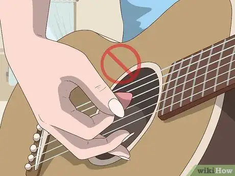 Image titled Play Guitar with Long Nails Step 1.jpeg