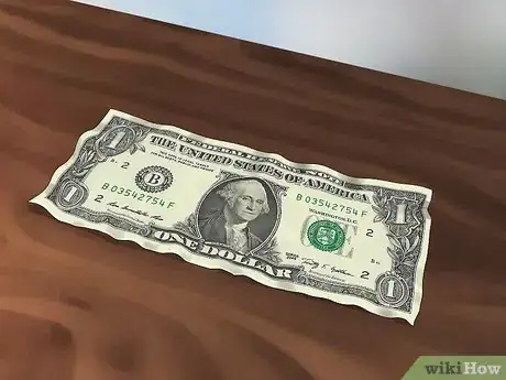 Image titled Straighten Out a Dollar Bill Step 1