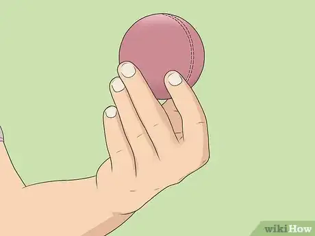 Image titled Grip the Ball to Bowl Offspin Step 2