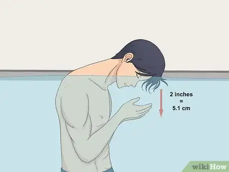 Image titled Swim Underwater Without Holding Your Nose Step 4