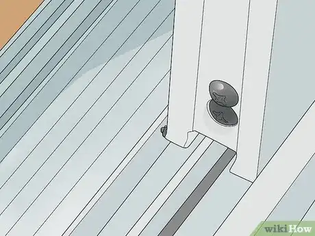 Image titled Adjust Sliding Glass Door Rollers Step 1