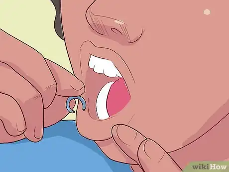 Image titled Take out a Lip Ring Step 5