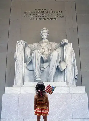 Image titled A little girl seeks inspiration in front of the statue of Abraham Lincoln