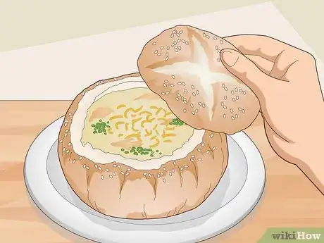 Imagen titulada Eat Soup Served in a Bread Bowl Step 1