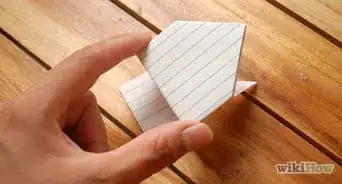 hacer una rana saltarina de origami con una ficha de cartulina