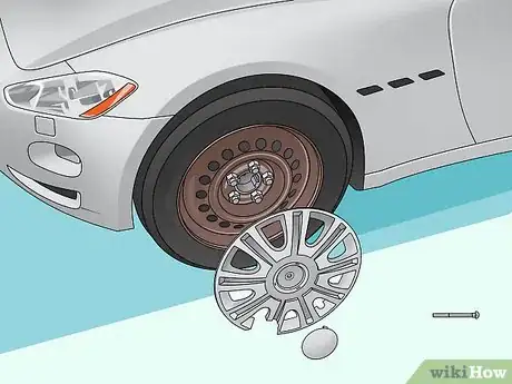 Imagen titulada Change a Hubcap Step 12