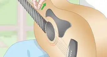 arreglar las cuerdas de guitarra