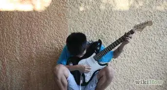 hacer movimientos con la guitarra